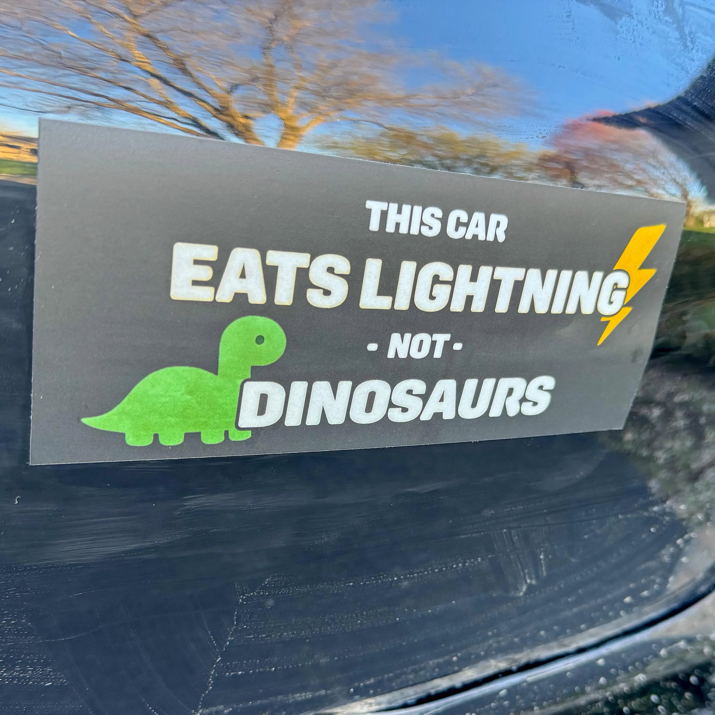 Electric Car Bumper Sticker • “This Car Eats Lightning Not Dinosaurs” • EV Clean‑Energy Vinyl Decal